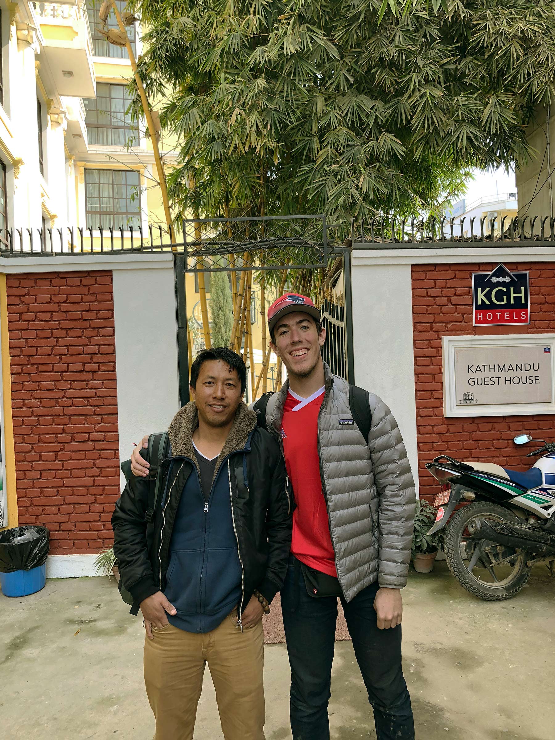 two young men standing at Kathmandu Guest House