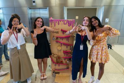 Four girls standing with design project.