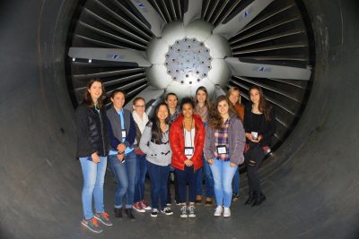 Students standing in jet engine