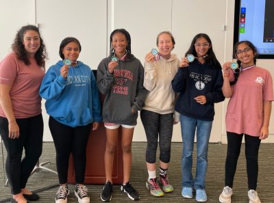 girls holding medals