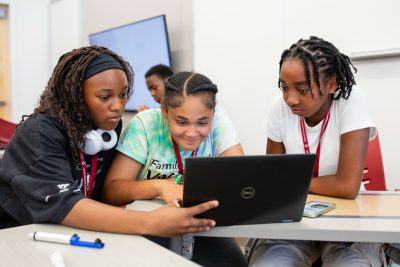 3 girls working on laptop