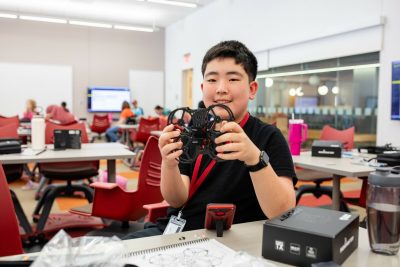 boy holding drone