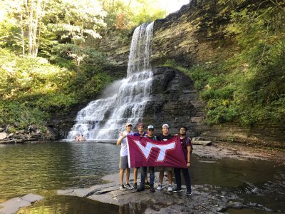 students holding VT flag at The Cascades