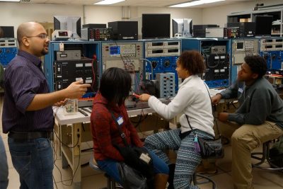 Students in a lab with an instructor.