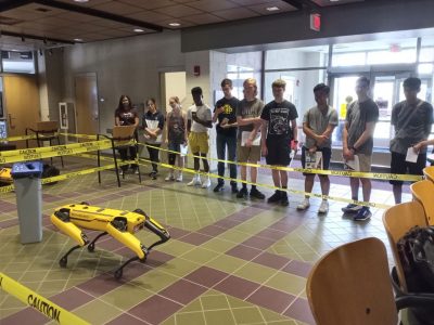 students observe the dog robot