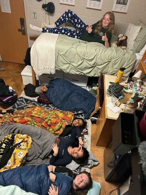 young women sleeping in dorm room