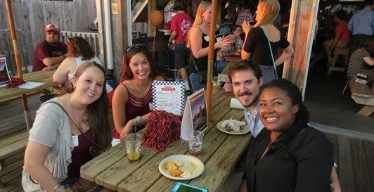 Alumni at a happy hour event