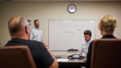 (From left to right) Christopher T. Link and Michael Clapman conducting an ITAC internal training on fall protection design philosophy.