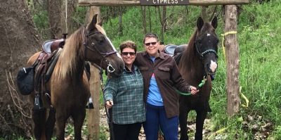 Lianne Lami (at left) with her wife, Denise Hamby, and their horses.