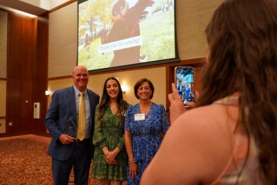 (From left) Tom Winters, scholarship recipient Marah Ghanem, and Shauna Winters stand for a photo at the Grado Department of Industrial and Systems Engineering's Academy of Distinguished Alumni induction ceremony. 