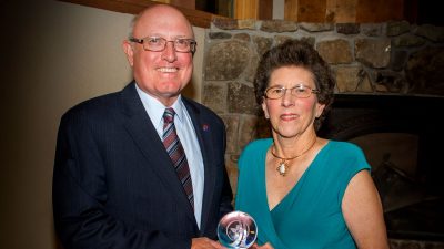 Carl "Buck" Belt ‘68 (at left) and Jane Adkisson Belt ‘70 receive a local award.