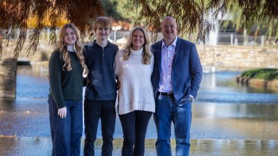 Ian Rehmert (far right) with his wife, Katherine (second to right), and their two children.