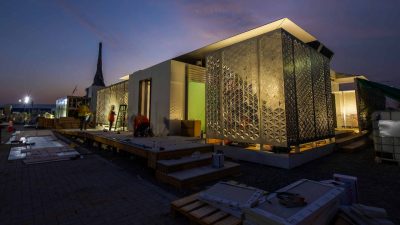 The FutureHAUS being built at dusk in Dubai by Virginia Tech Students.