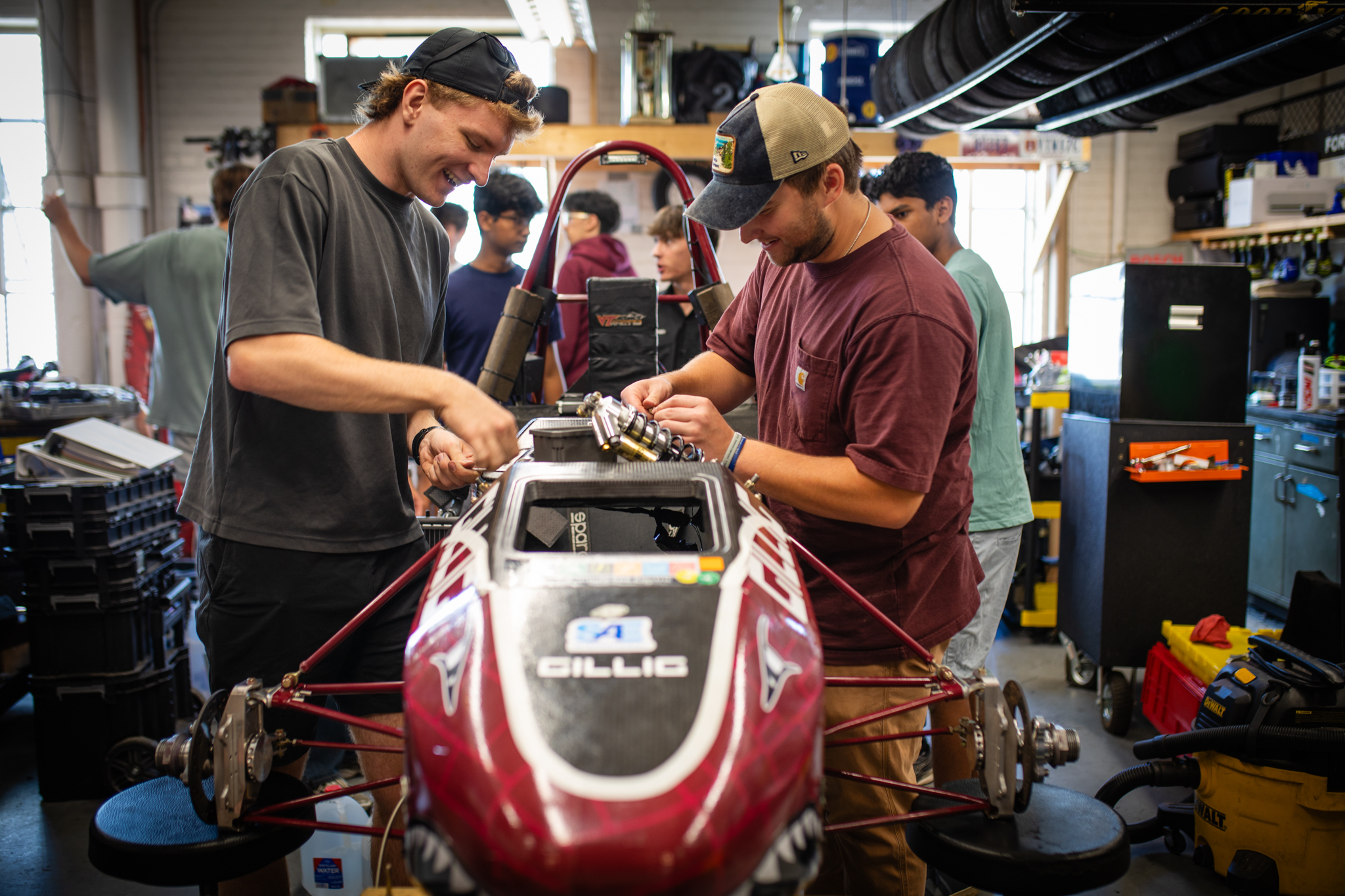 The formula team members working on the car in the Ware Lab.