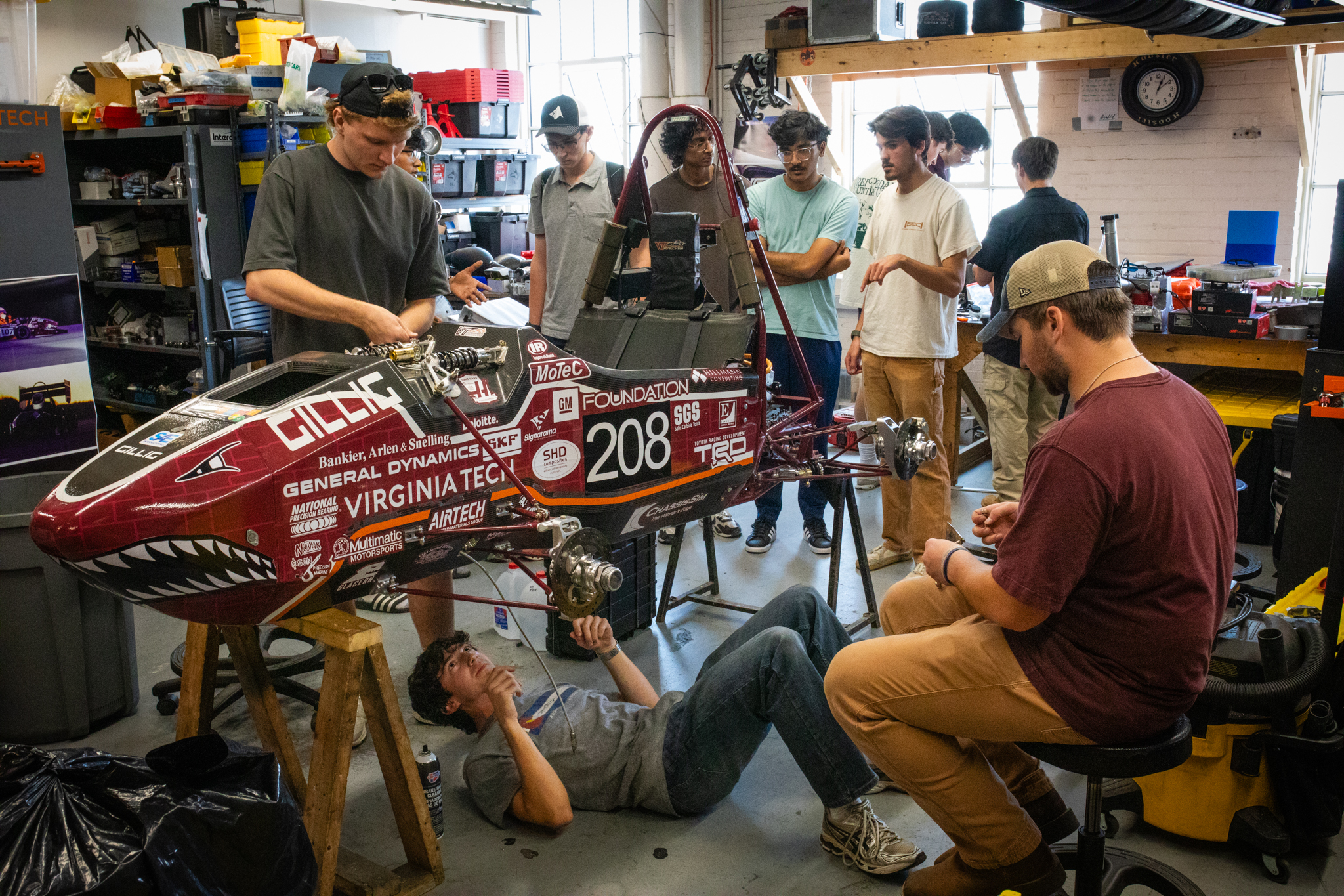 The formula team members working on the car in the Ware Lab.