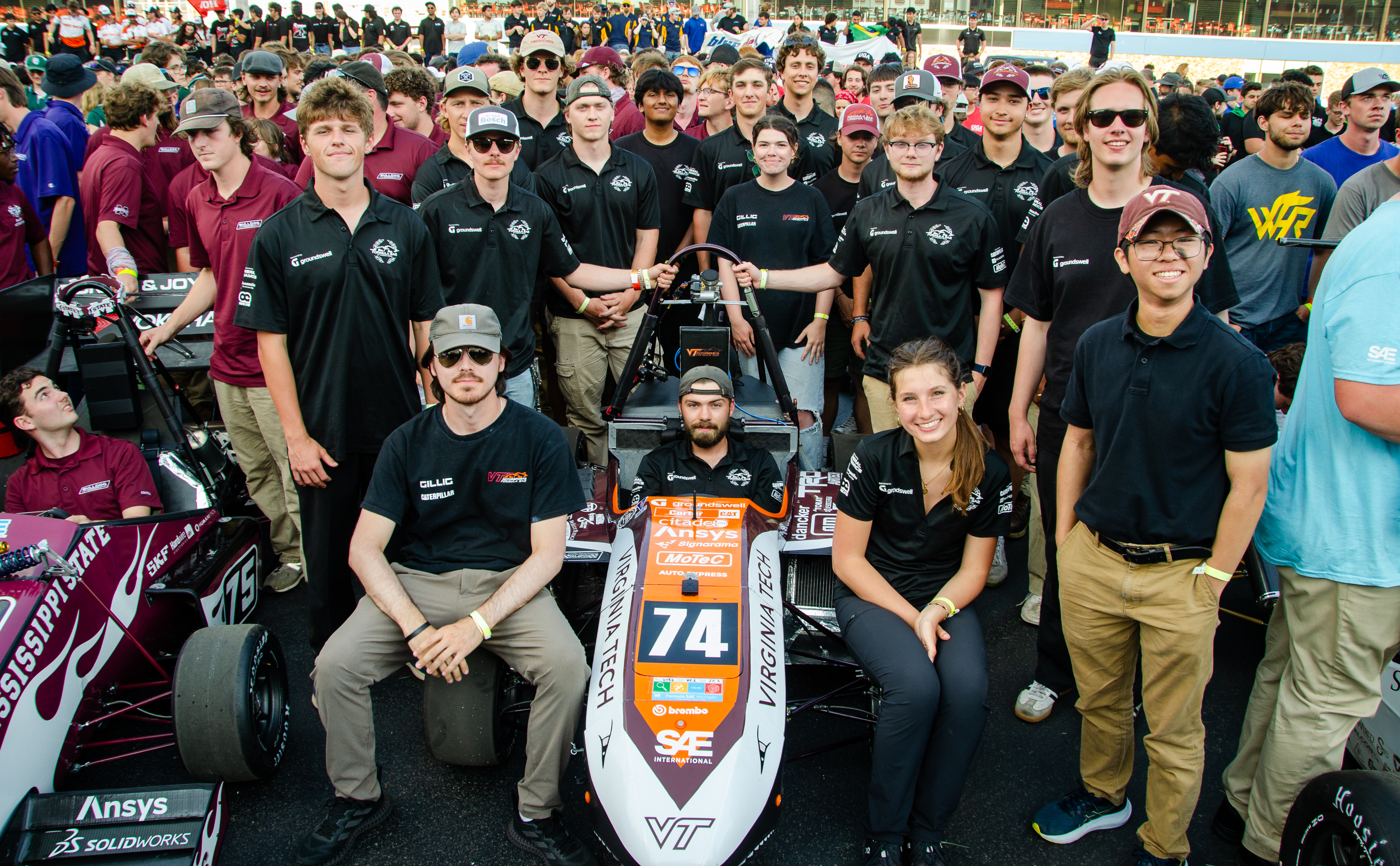 The team in a giant group photo with other teams at competion.