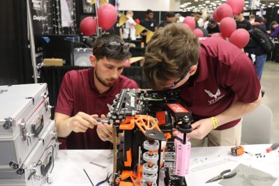 VT-CRO team members work on a robot.