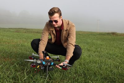 At Kentland Farm, Garrett Asper prepares a multi-rotor drone for a series of test flights. 