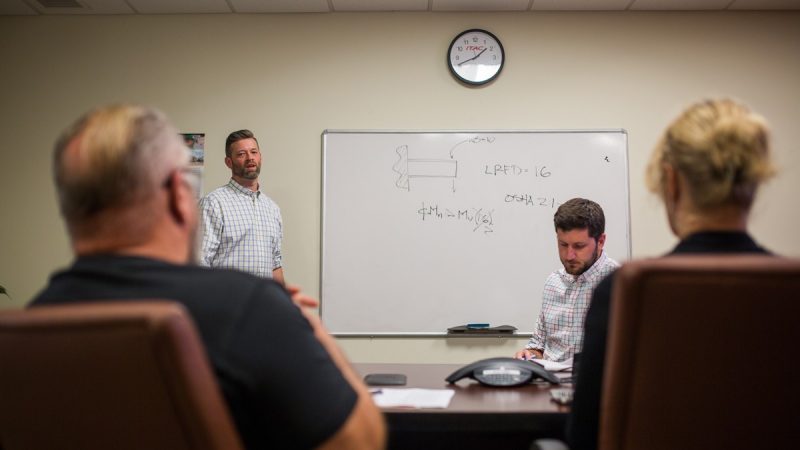 (From left to right) Christopher T. Link and Michael Clapman conducting an ITAC internal training on fall protection design philosophy.