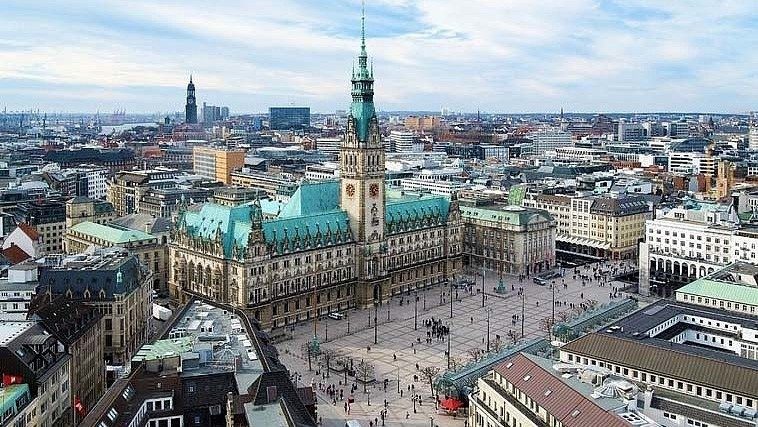 Historical building together in a downtown setting with a walking area in between buildings