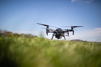 A drone in a grassy field.