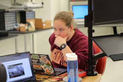 A student working in front of a laptop