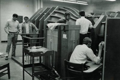 Researchers work in the open jet tunnel in Randolph Hall, 1969.