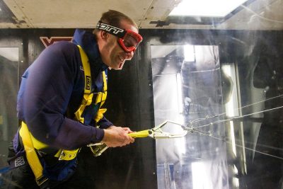 A man in the wind tunnel fighting the strong wind in 2009.