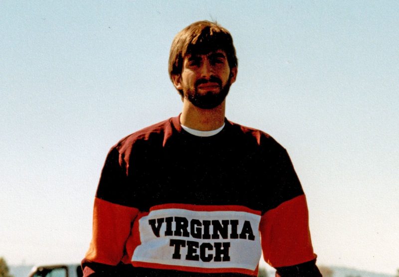 Tom Taylor wearing a Virginia Tech sweatshirt during his during his college years.