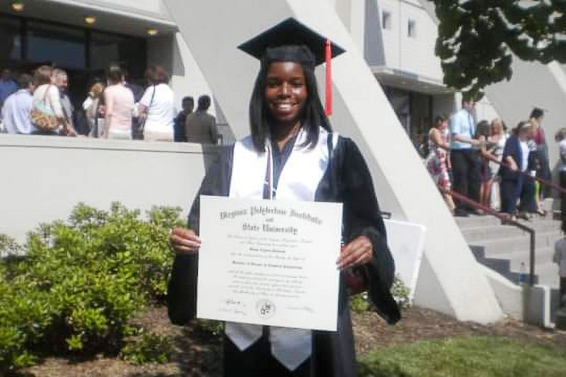 Renee Pinnock outside of Cassell with her diploma on commencement day.