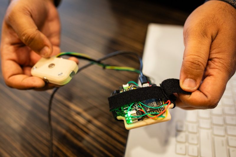 The wearable technology, in beta form is worn on the wrist and held in the hand.