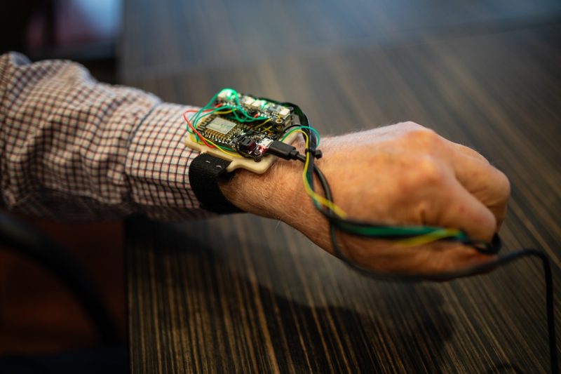 The test subject's forearm wearing the wrist and hand device.