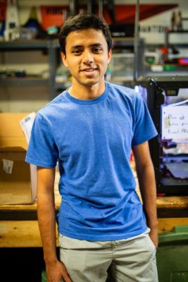 Niranjan Aradhey poses for a photo in their lab.