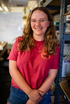 Cara Johnson poses for a photo in their lab.