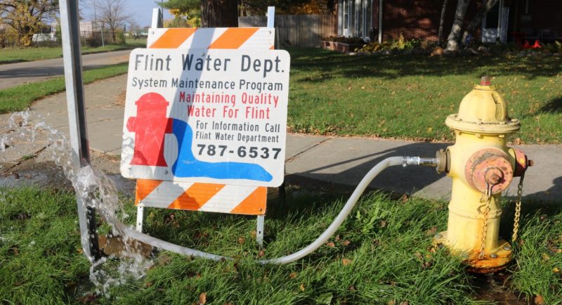A fire hydrant spews out water in Flint, Michigan.