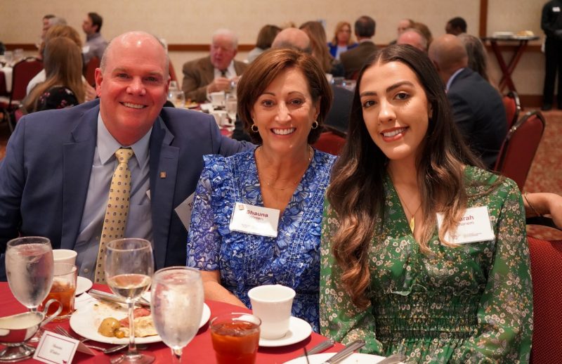 Tom Winters (far left), Shauna Winters, and their scholarship recipient Marah Ghanem sit together at the ISE Academy of Distinguished Alumni induction dinner.