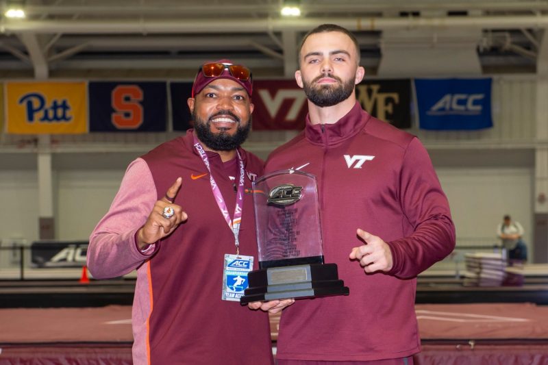 Cole Beck and coach Tim Vaught pose with trophy to celebrate win during Virginia Tech Track & Field 2022 ACC Indoor Championships Day 3. Photo by Dave Knachel for Virginia Tech.